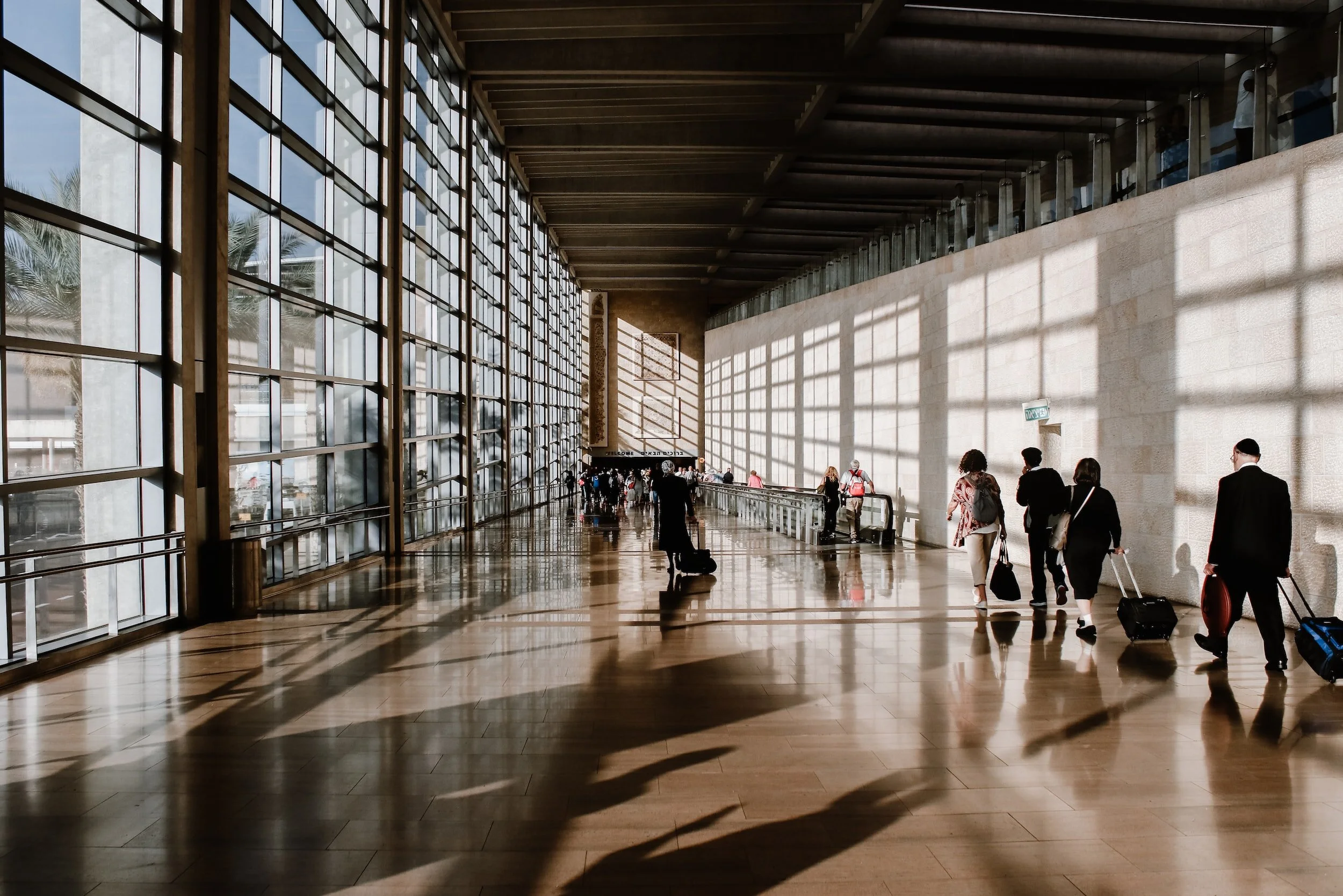 Photo of passengers walking through an airport terminal, one of the asset types that Australis provides asset and valuation services for.
