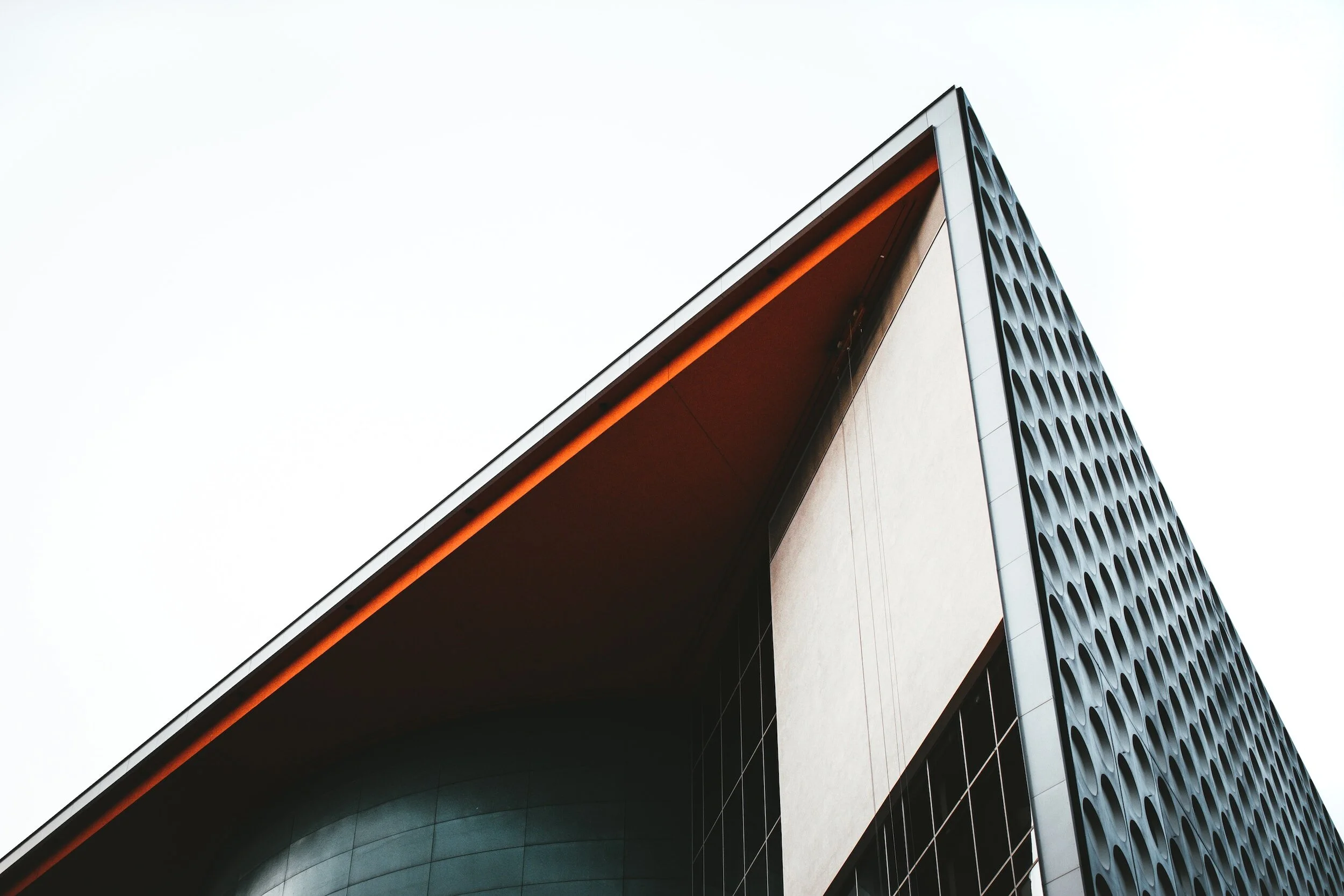 Photo of an architecturally designed building, looking up towards it