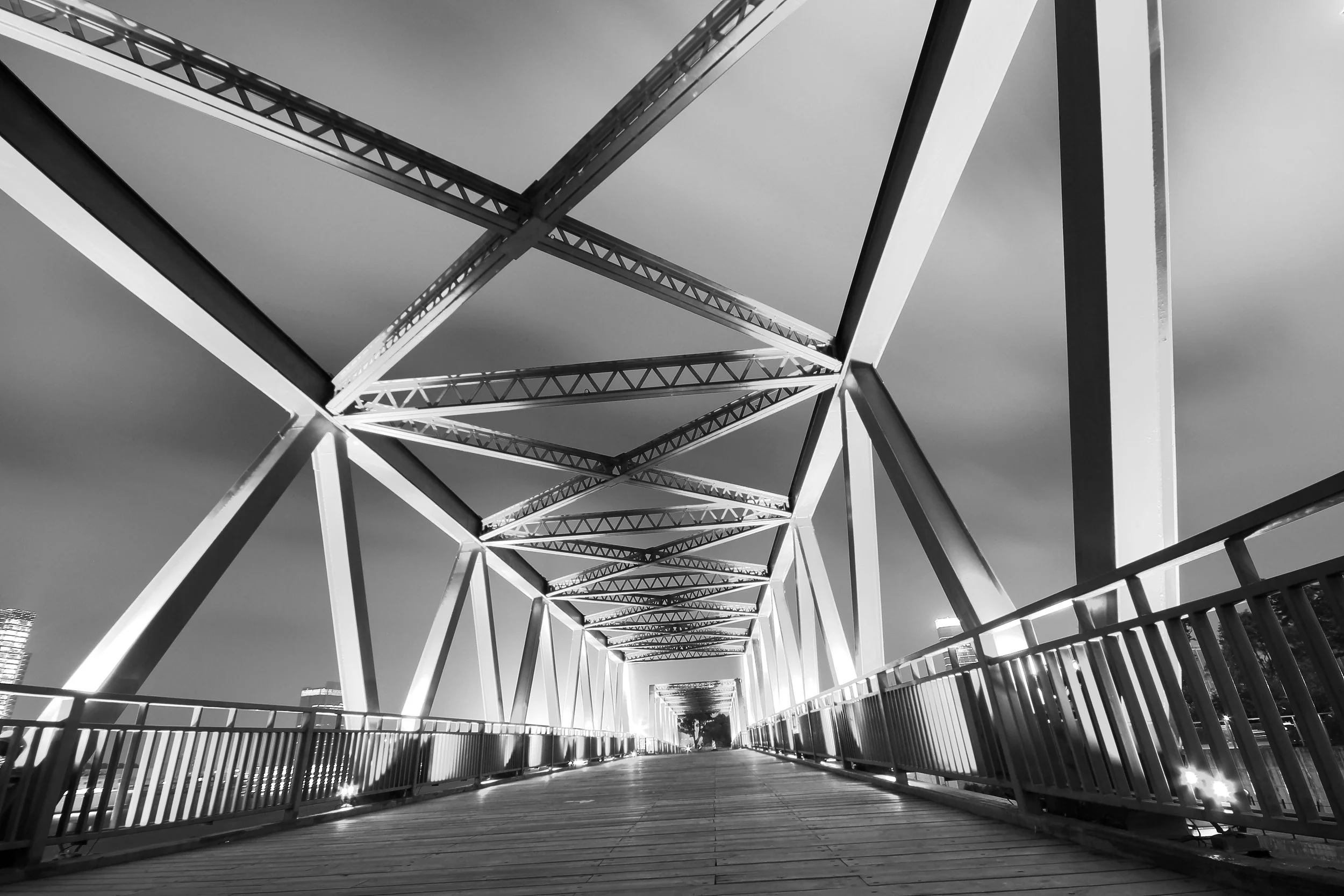 Photo of an architecturally designed footbridge with timber decking
